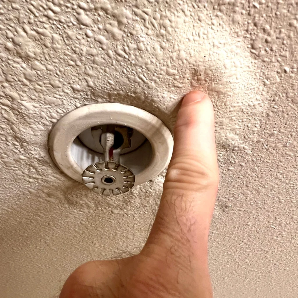 Roof emergency interior water damage stain on ceiling