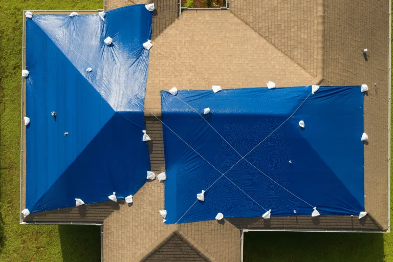 Emergency roof repair Orlando — blue tarp on storm-damaged roof