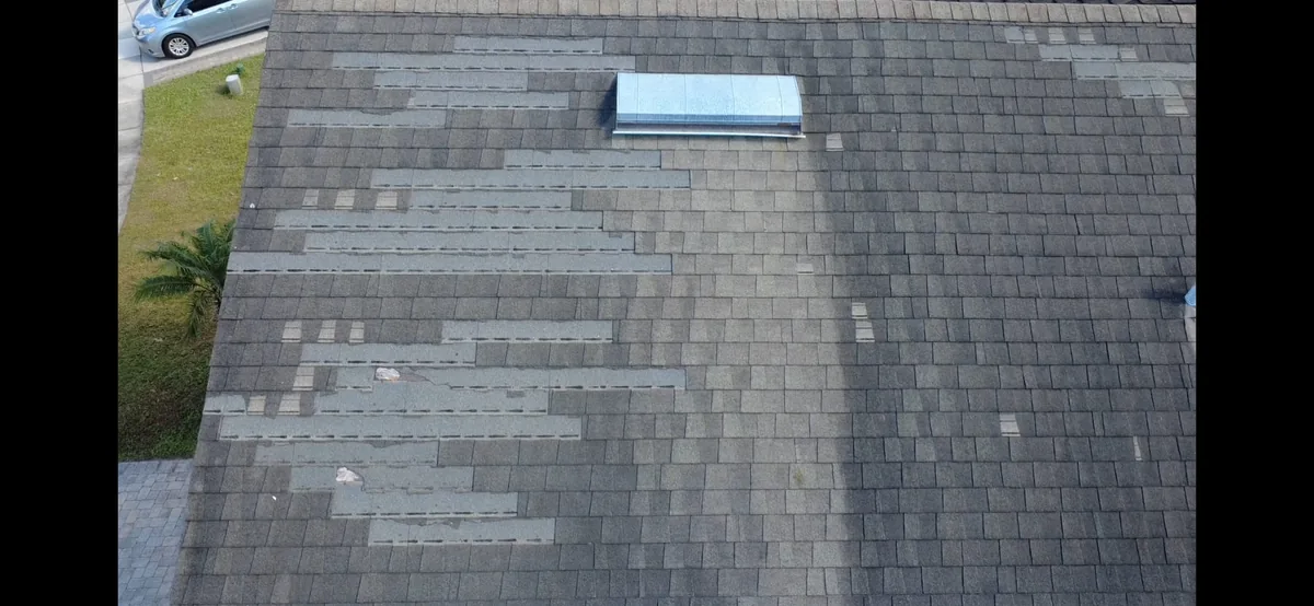 Storm damage restoration Orlando — damaged shingles roof inspection